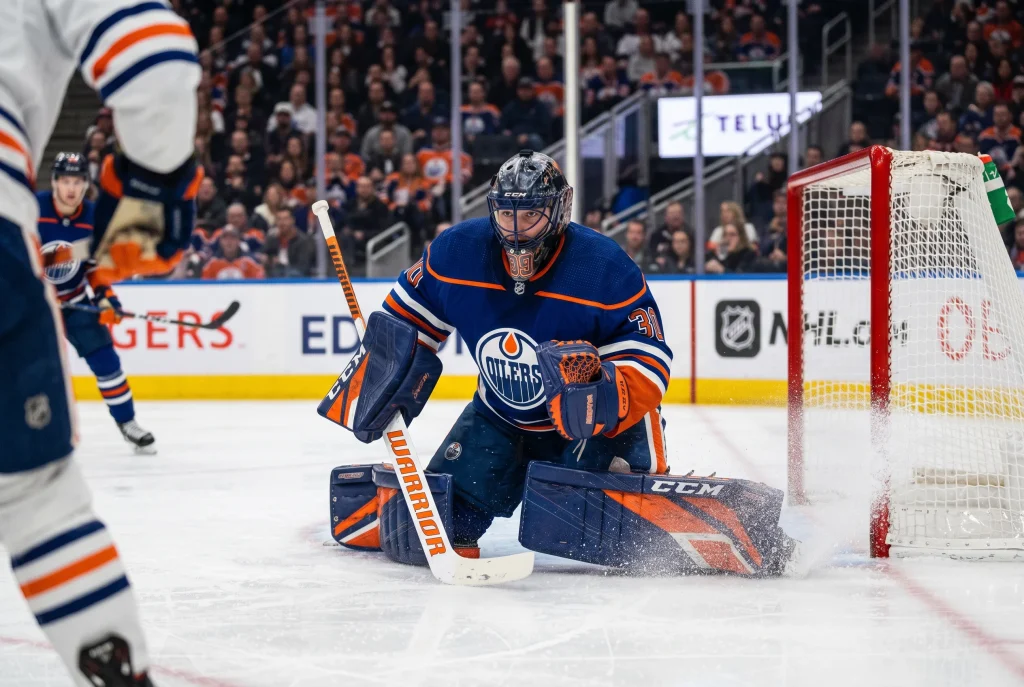 Gardien de hockey NHL en position d'arrêt avec statistiques de performance